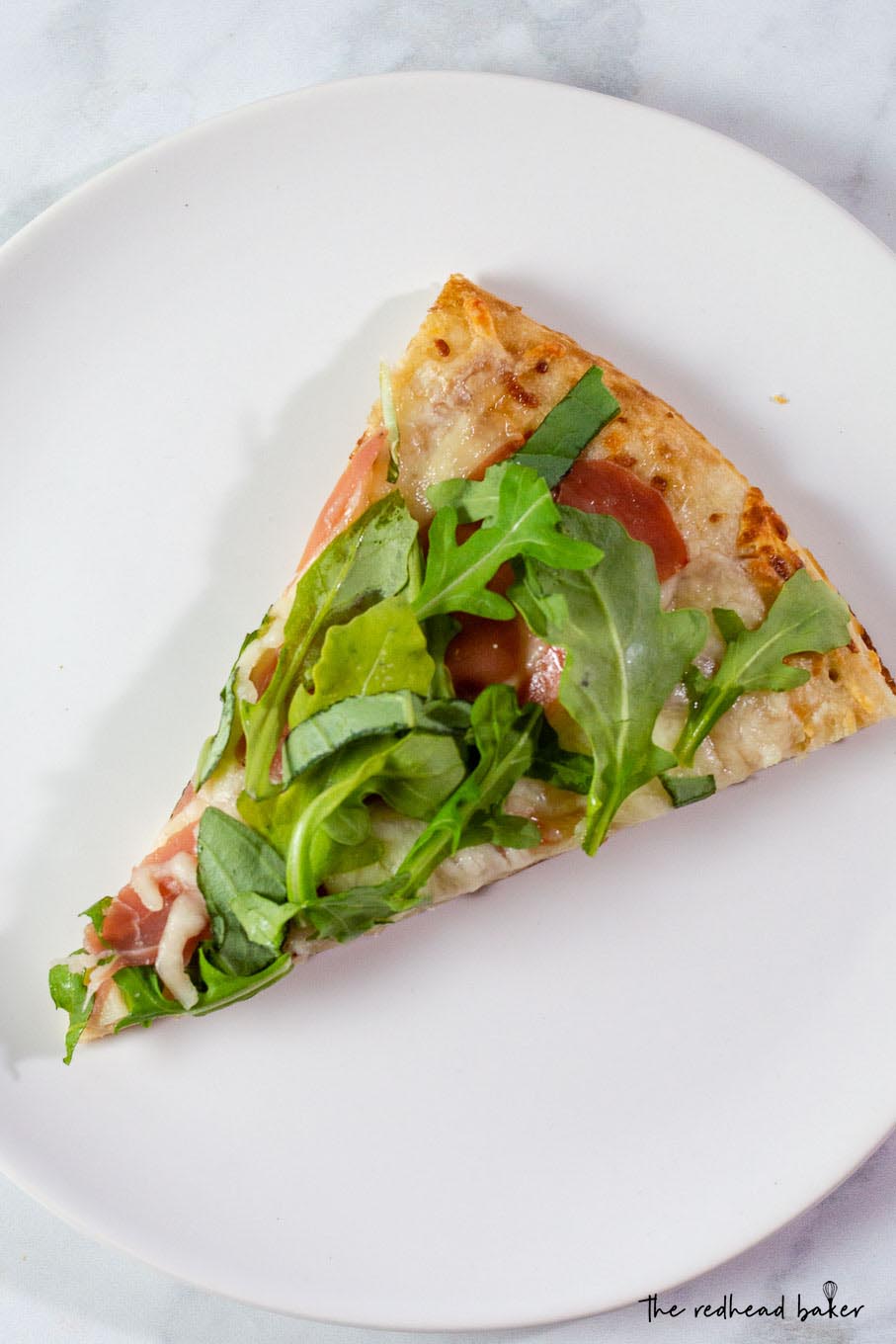 White pizza with prosciutto and rocket