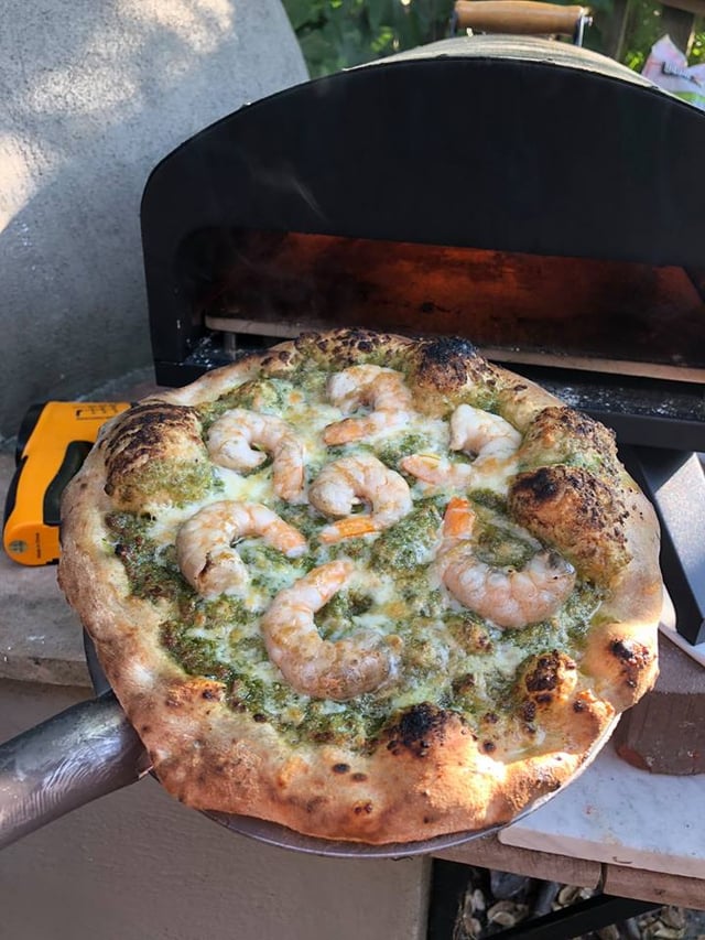 Shrimp pizza baked in a wood-fired oven